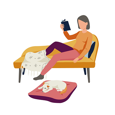 cartoon image of a woman on a couch reading a book with a dog sleeping on a pillow next to her